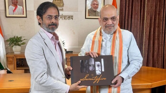Union Minister Amit Shah presented Network18's coffee table book capturing PM Modi's life