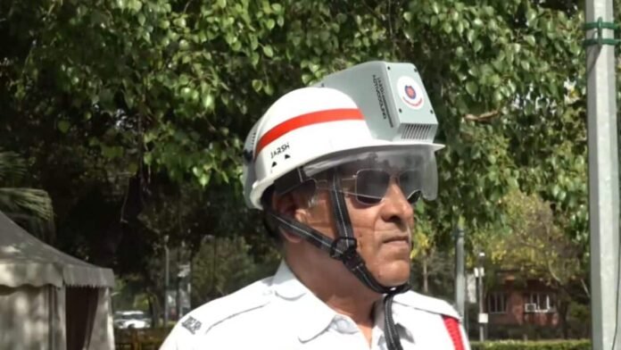 As Delhi heatwave breaks records, traffic cops use 'AC helmets' and hand fans to stay cool